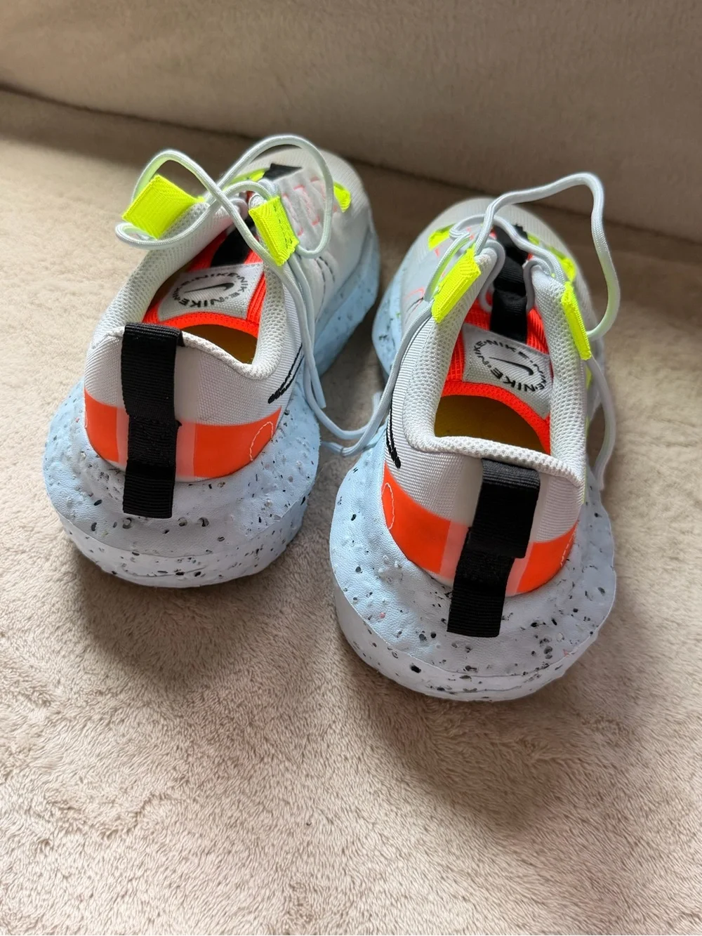 Nike Women’s White Athletic Shoes with Neon Yellow and Orange Accents